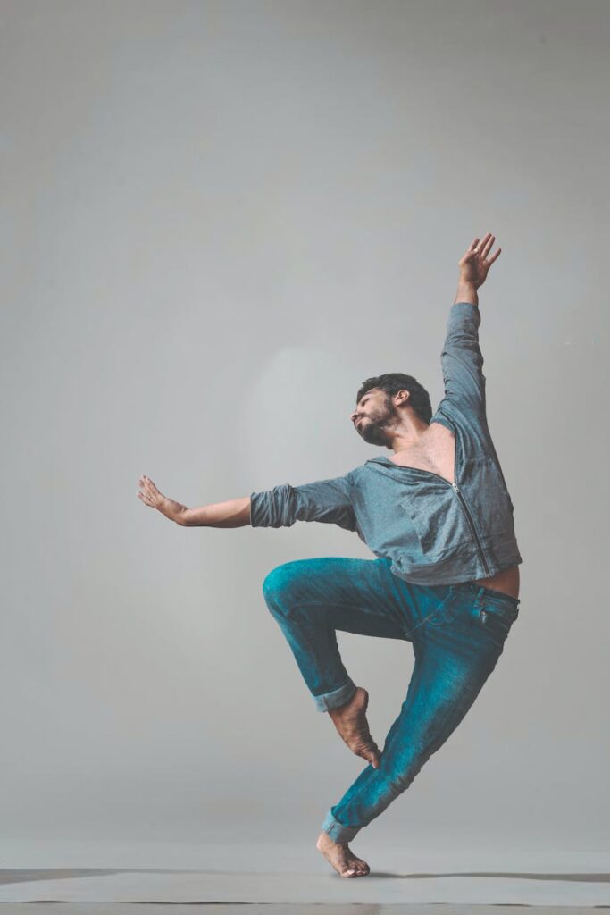 dancing man wearing pants and long sleeved shirt